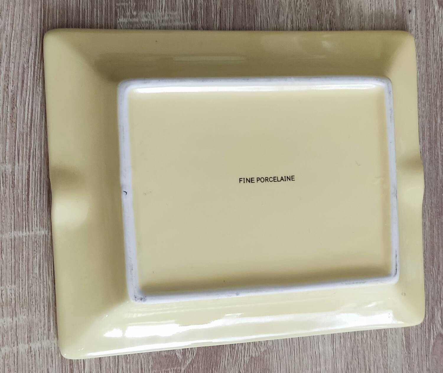 Vintage fine yellow and gold porcelain ashtray.