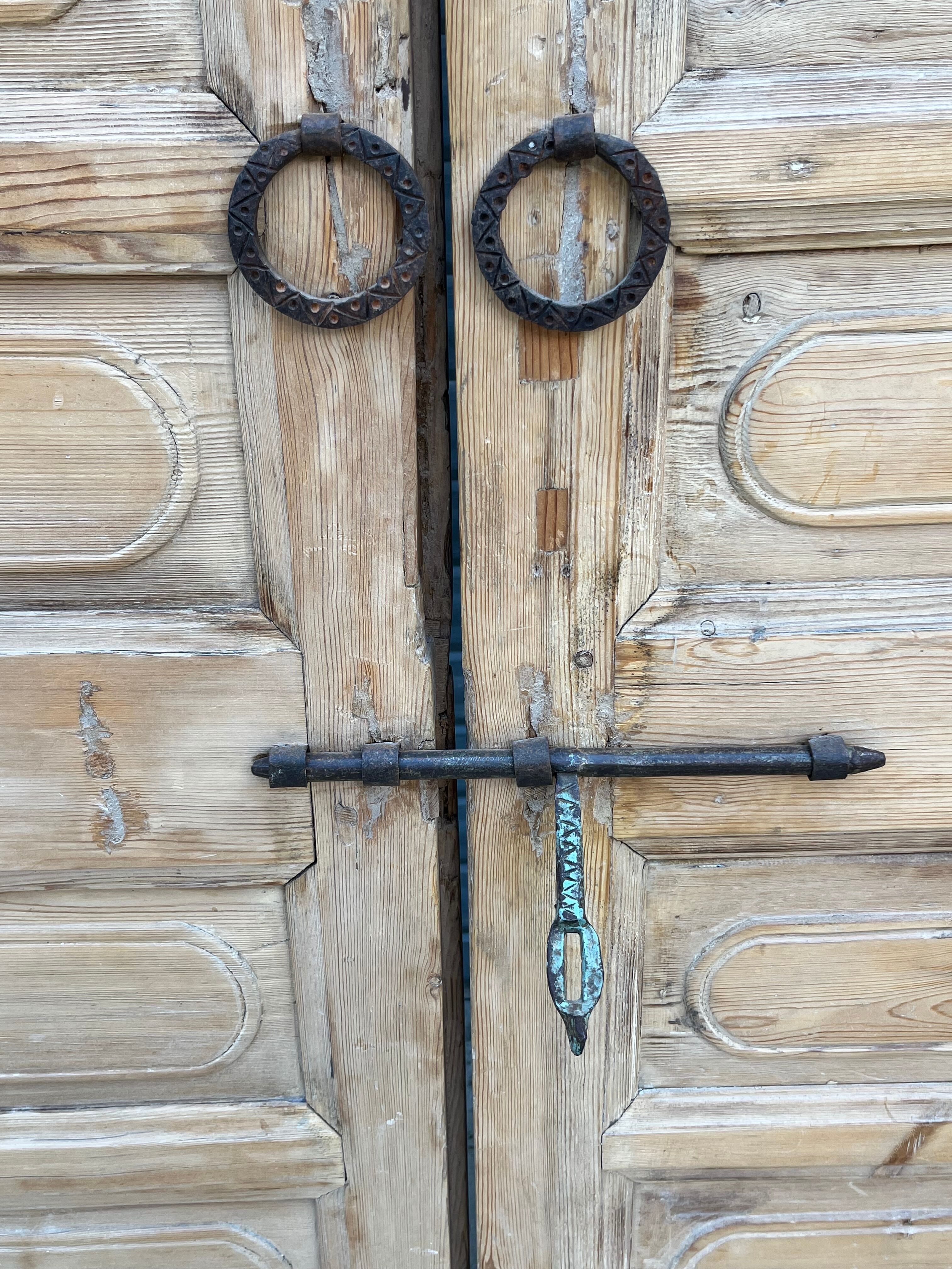 pair of old double-leaf doors with transom and carved frames