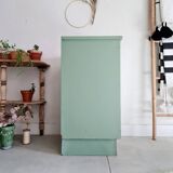 Old chest of drawers with two green drawers