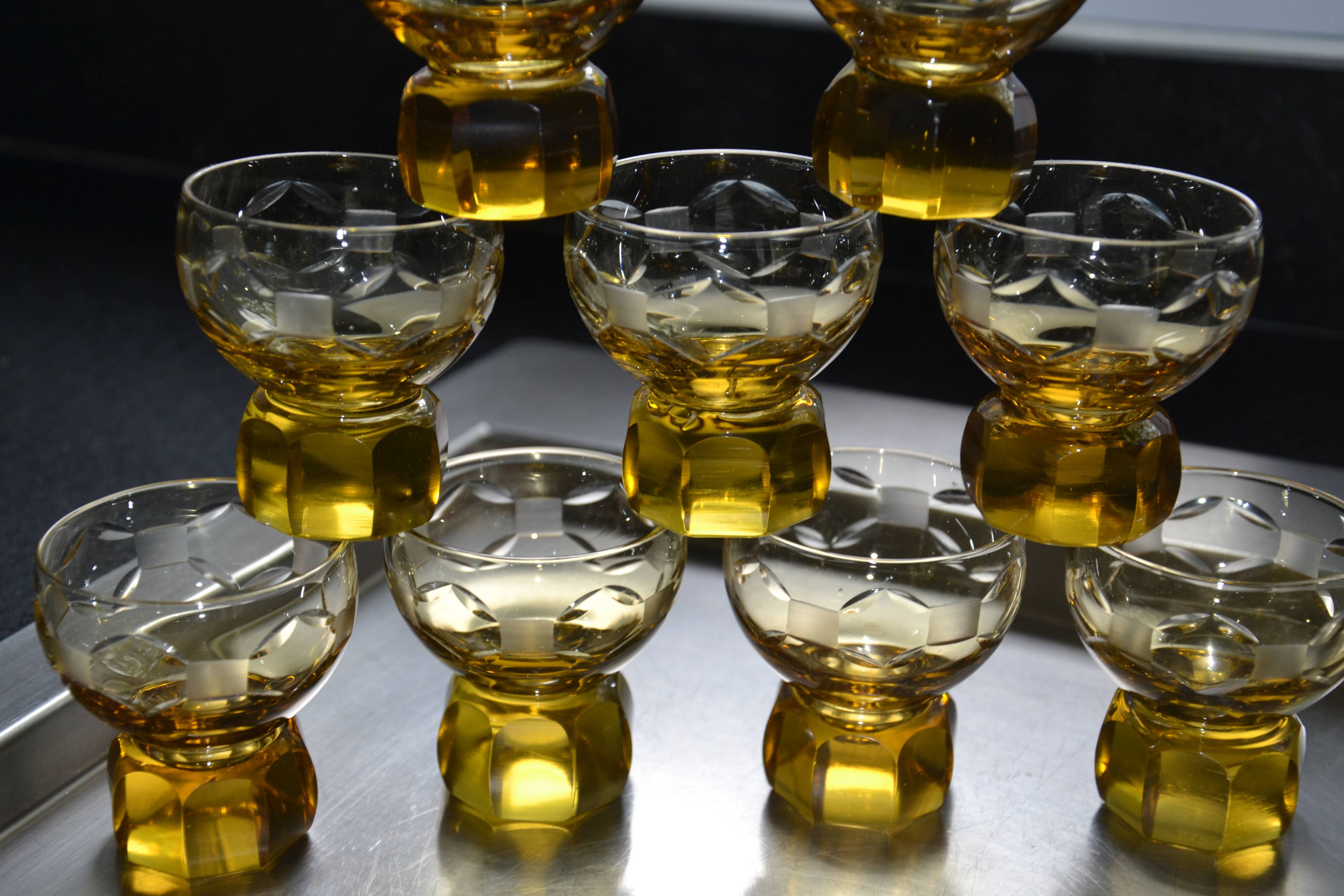 9 small amber art deco glasses