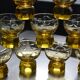 9 small amber art deco glasses