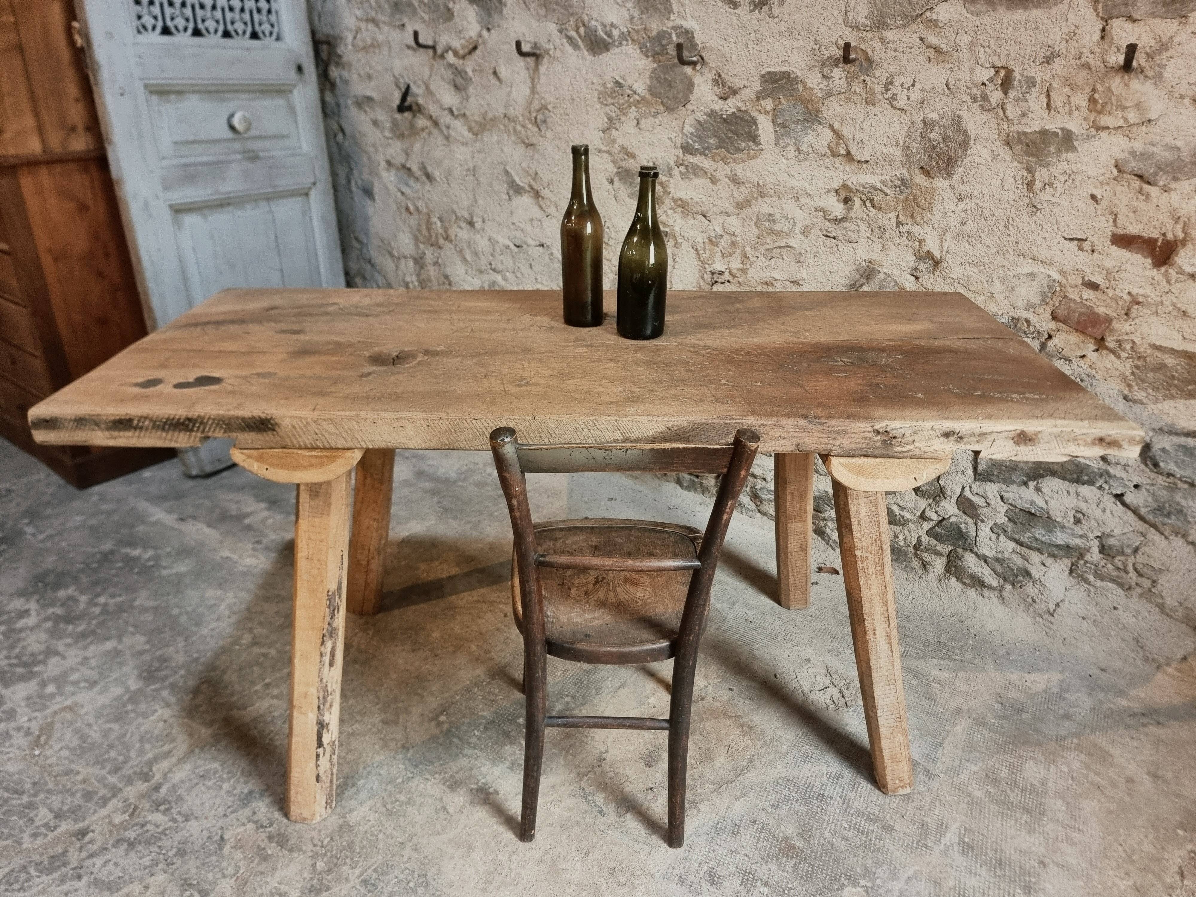 Antique work table / primitive dining table in oak, Hungary, circa 1900–1930.