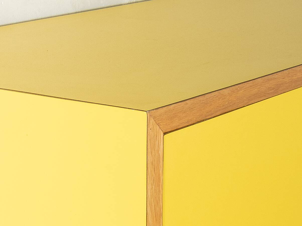 Classic sideboard from the 1960s, oak veneer, yellow Resopal, white steel feet