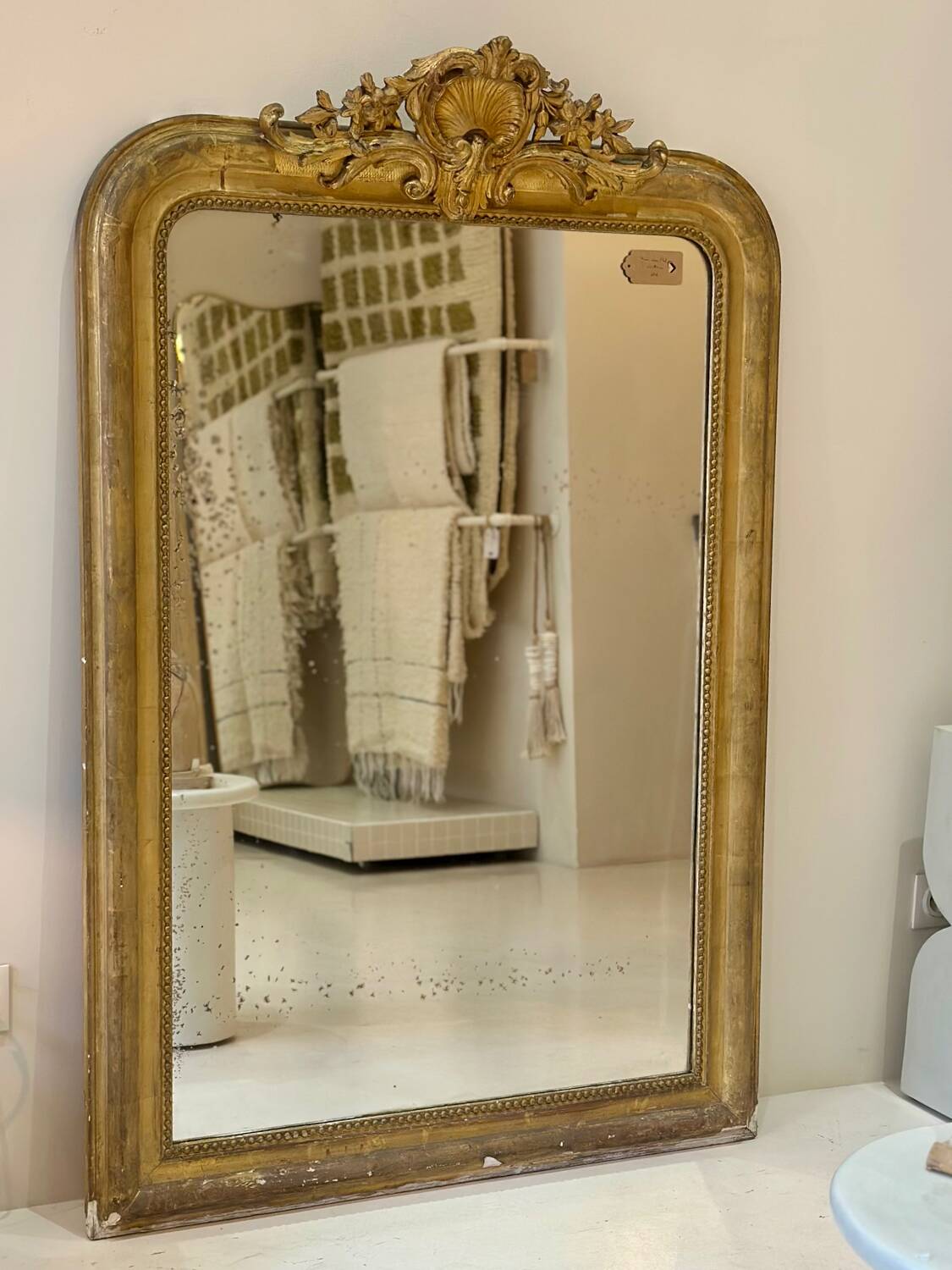 Antique Louis-Philippe mirror carved and gilded with leaf