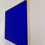 Framed monochrome blue abstract painting.