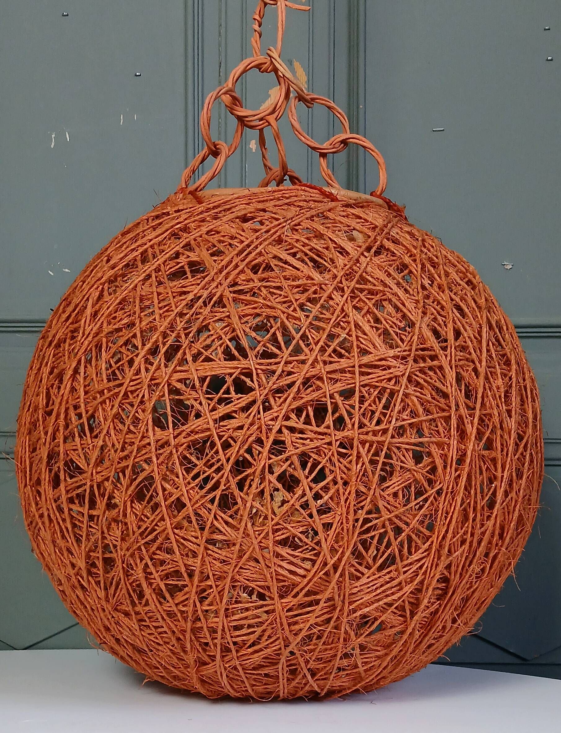 Orange lampshade in cord and rattan from the 1970s