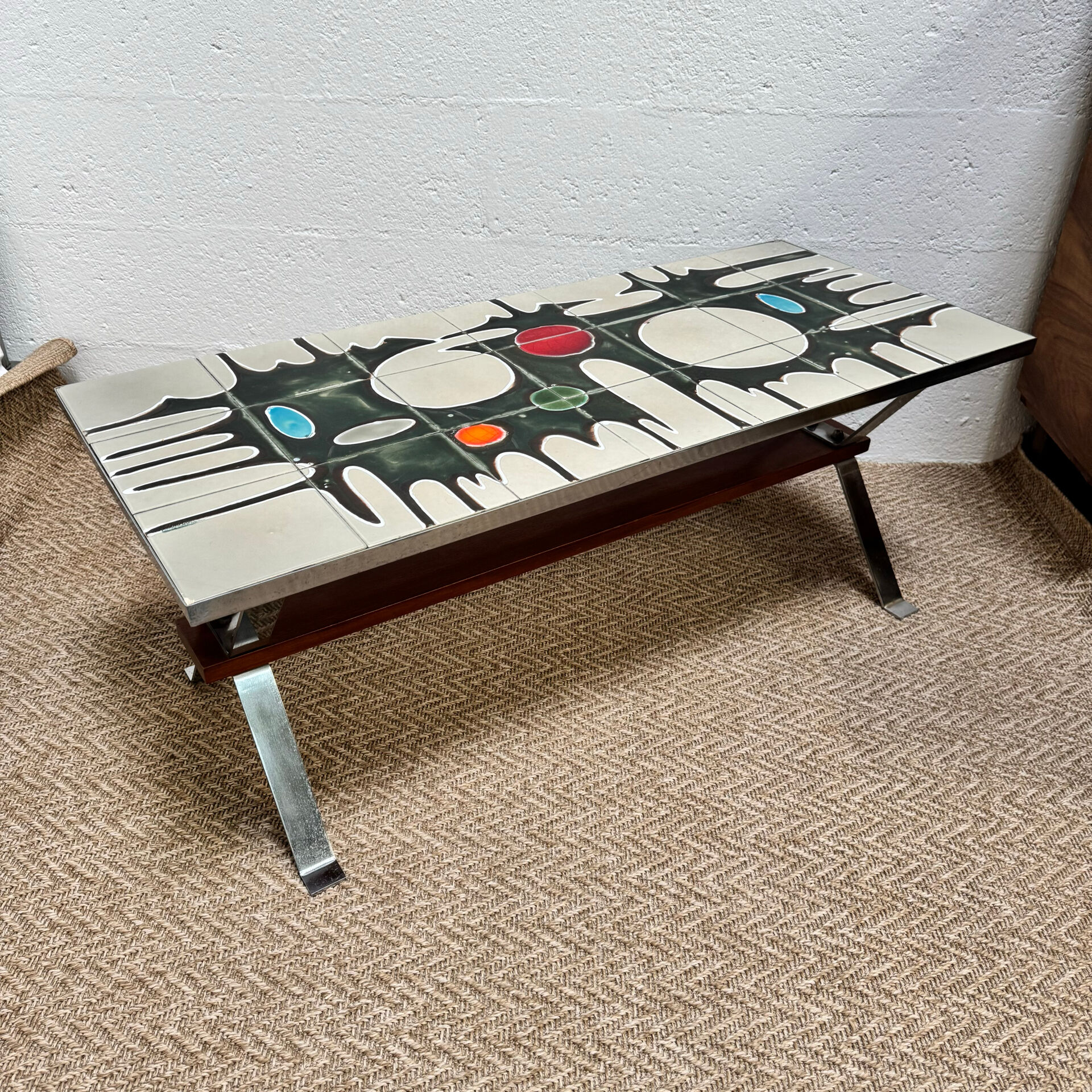 Vintage coffee table from the 60s and 70s in ceramic, chrome metal, and wood.