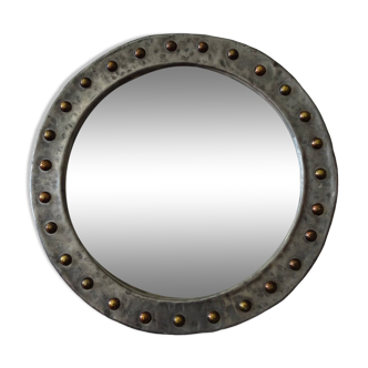 Round mirror in hammered metal vintage brutalist style from the 70s