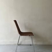Chair design in rattan, woven wicker and chrome wire metal.