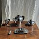 Tea set including teapot, milk jug, sugar bowl and butter dish