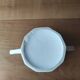 Antique porcelain sugar bowl with a decagonal base.