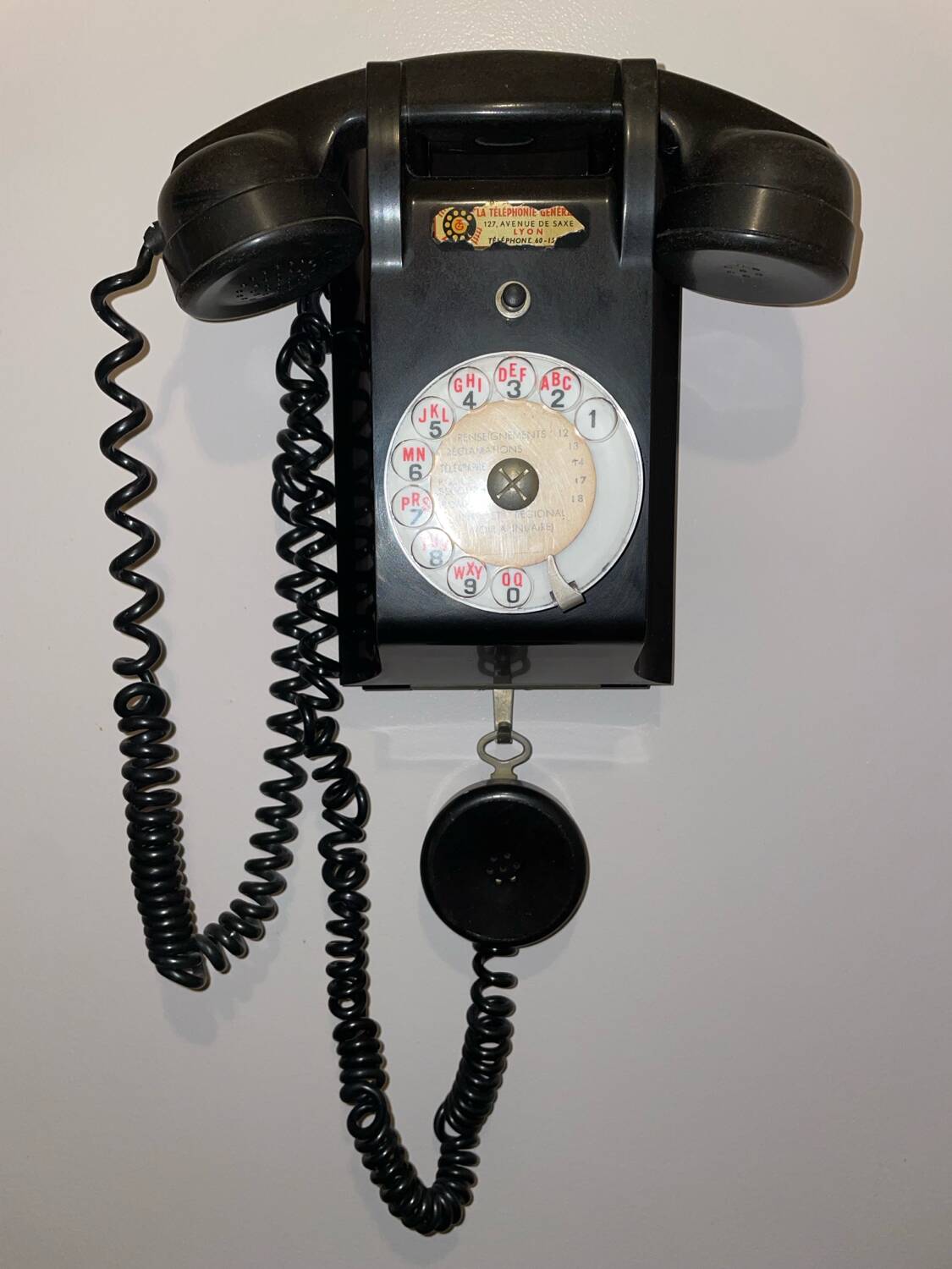 Old Ericsson wall telephone in black bakelite