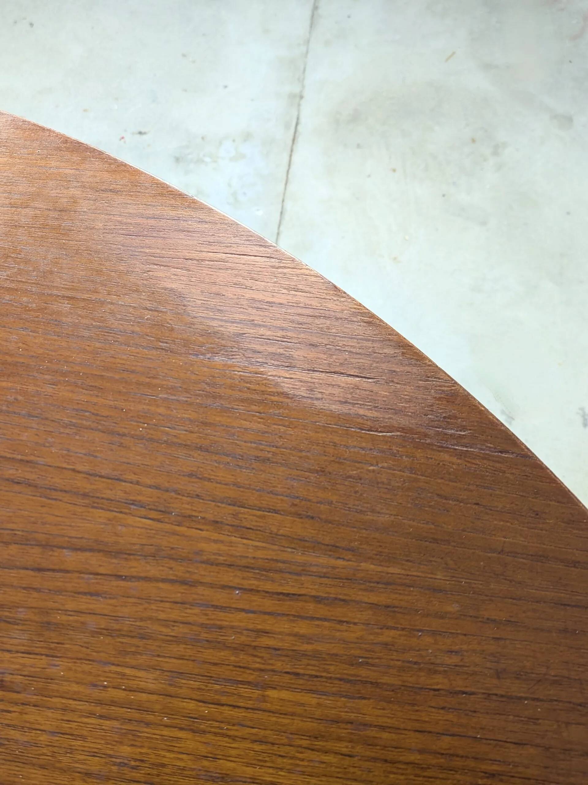 Round extendable wooden dining table