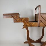 Worker on vintage wooden legs