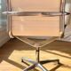 ICF armchair in white leather, four-star base on glides