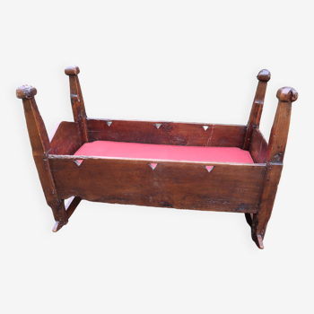 A natural wood cradle, rustic work from the 19th century
