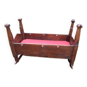 A natural wood cradle, rustic work from the 19th century