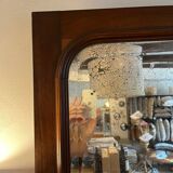 Beveled mirror with wooden contours