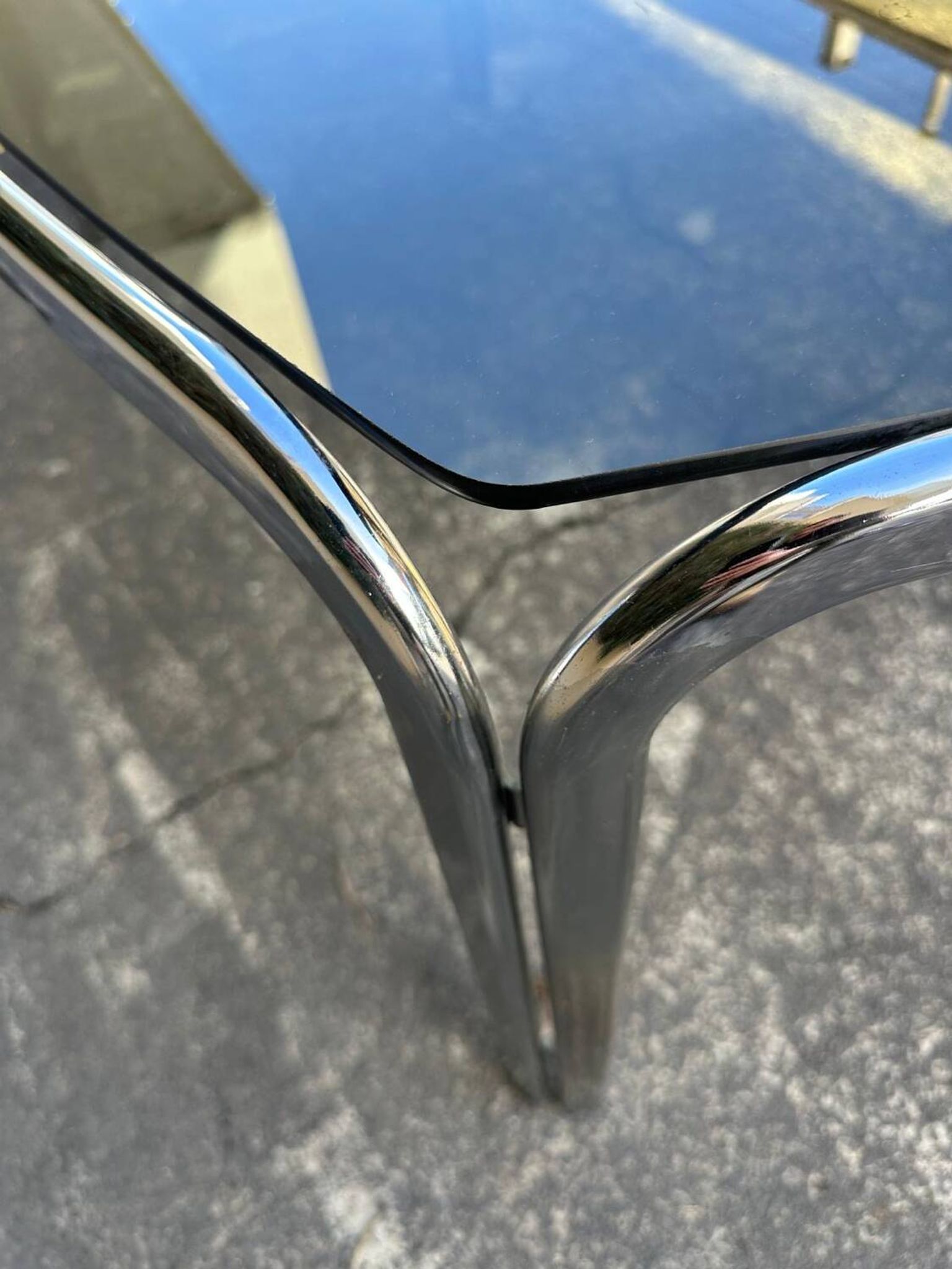 Vintage curved rectangular dining table in smoked glass and metal.