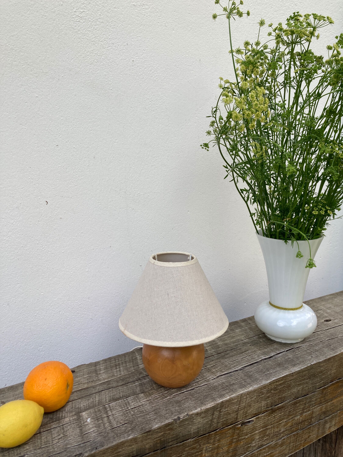 Wooden ball bedside lamp and beige lampshade