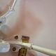 set of 2 vintage white cast iron hooks, small paint chips from the year