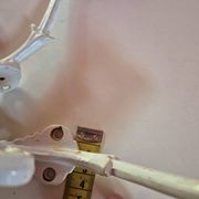 set of 2 vintage white cast iron hooks, small paint chips from the year