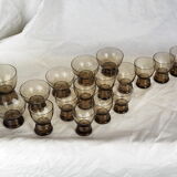 Set of 17 black smoked glasses on geometric engraving stand - 70s