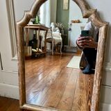 Patinated gilded mirror in wood and plaster