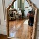 Patinated gilded mirror in wood and plaster
