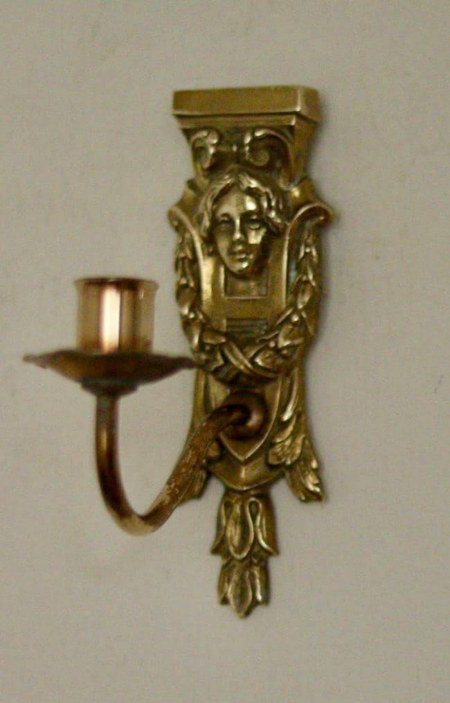 Pair of mid-century Swedish brass face motif sconces