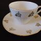 Set of six Art Deco white fine porcelain coffee cups and saucers