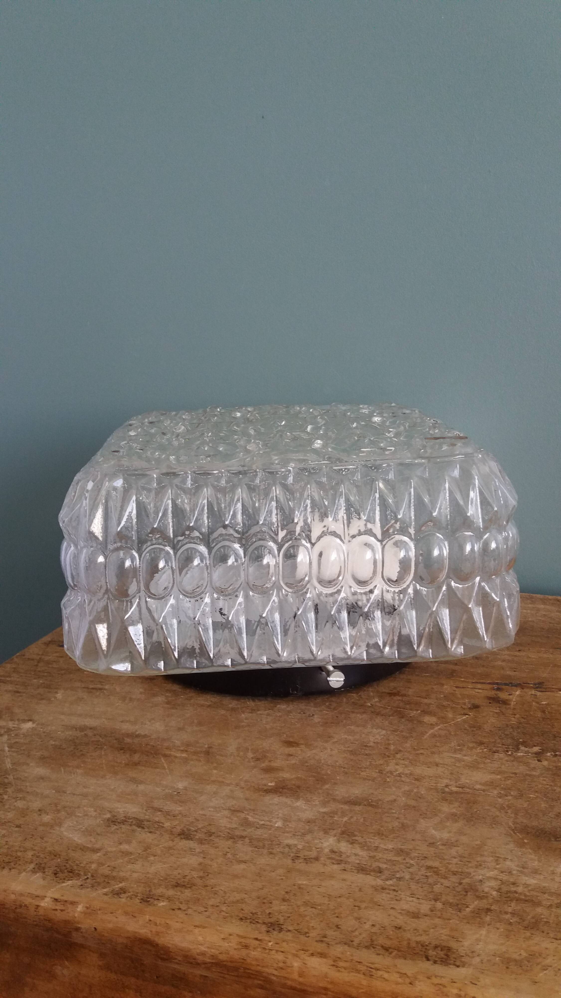 Square globe ceiling light in moulded glass.