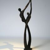 Tanned sculpture, "dancing couple". Signed M.N