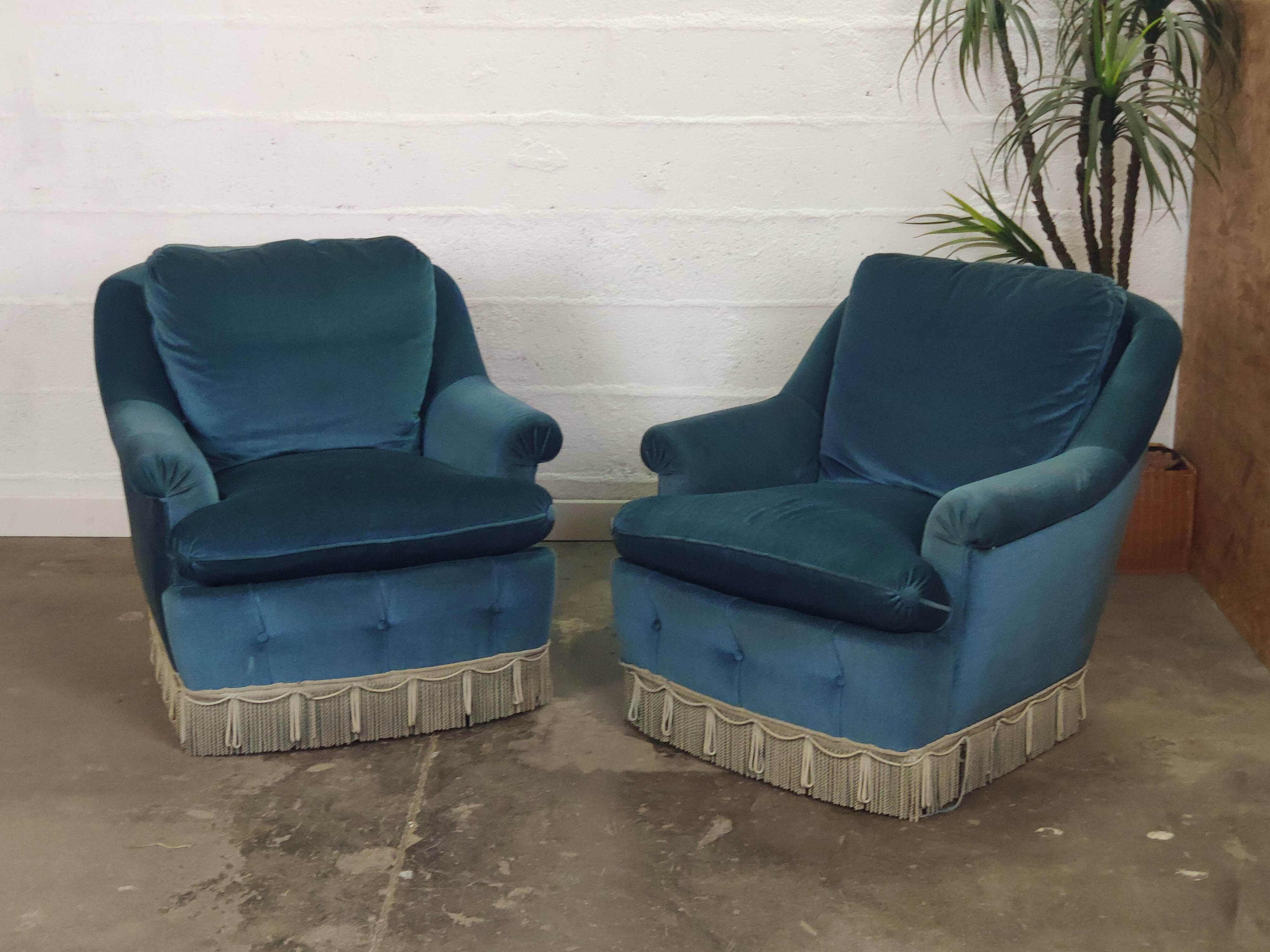 Pair of blue velvet armchairs with fringes