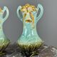 Pair of Art Nouveau vases in glazed ceramic with floral decoration, 20th Century