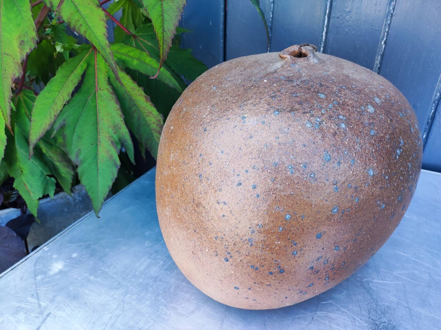 Vintage sandstone vase, in the shape of a rugby ball, signed