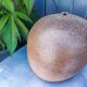 Vintage sandstone vase, in the shape of a rugby ball, signed