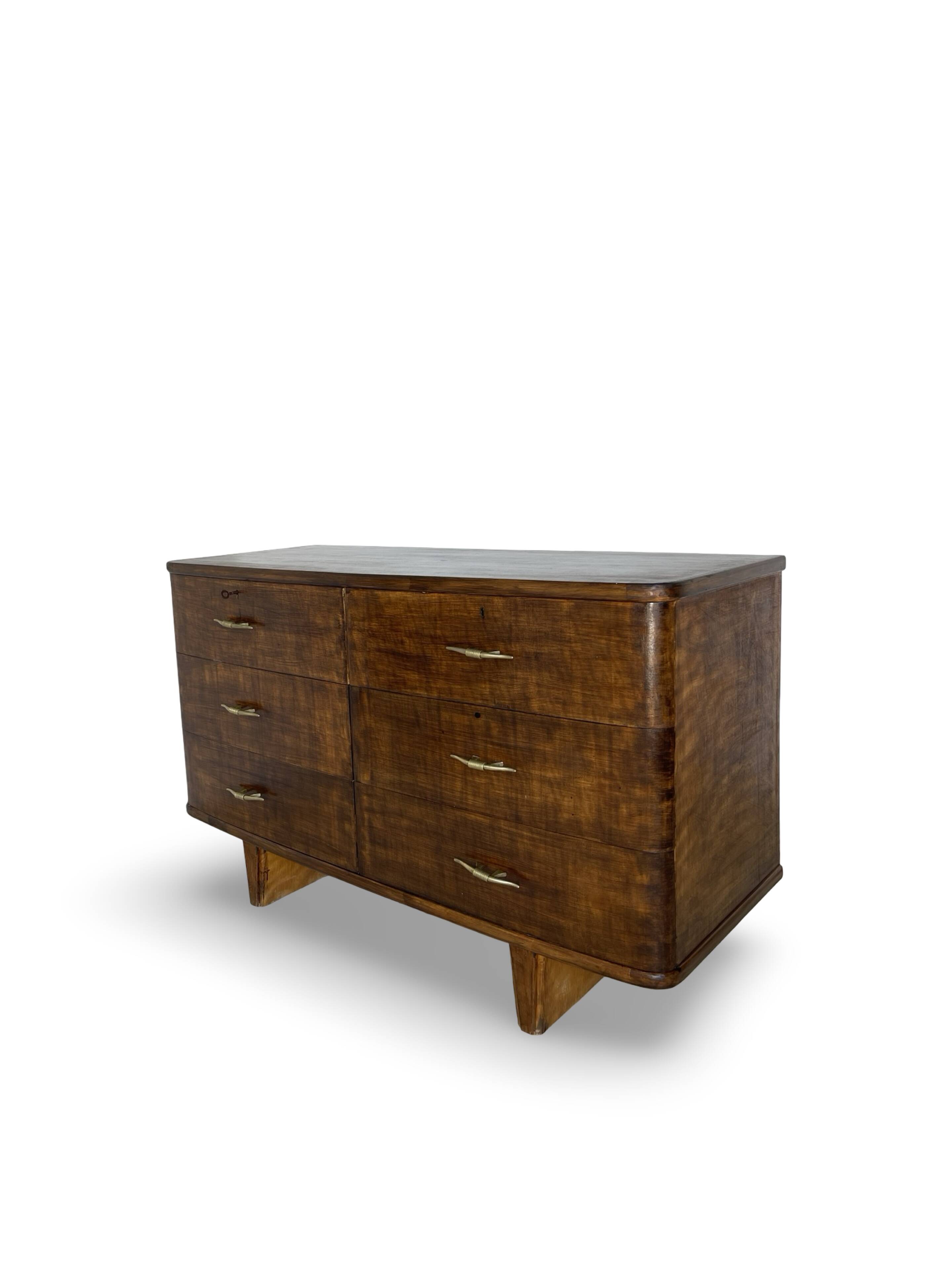 A vintage Italian chest of drawers, made of veneered walnut and solid wood,