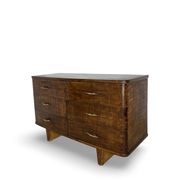 A vintage Italian chest of drawers, made of veneered walnut and solid wood,