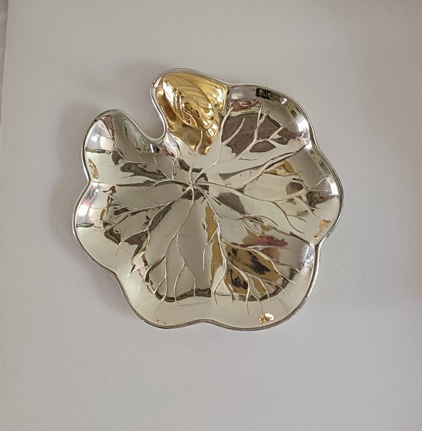 A Lancel pocket tray in silver metal.