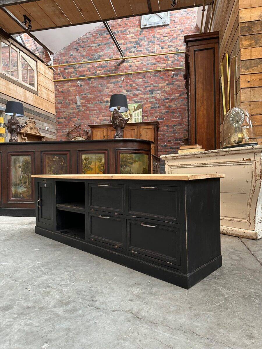 Old workshop furniture transformed into a TV unit.