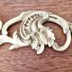 2 ornaments and an antique bronze pediment