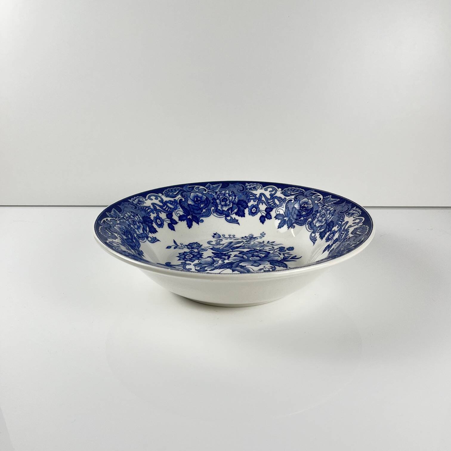 Blue earthenware salad bowl with floral and bird decoration, early 20th century