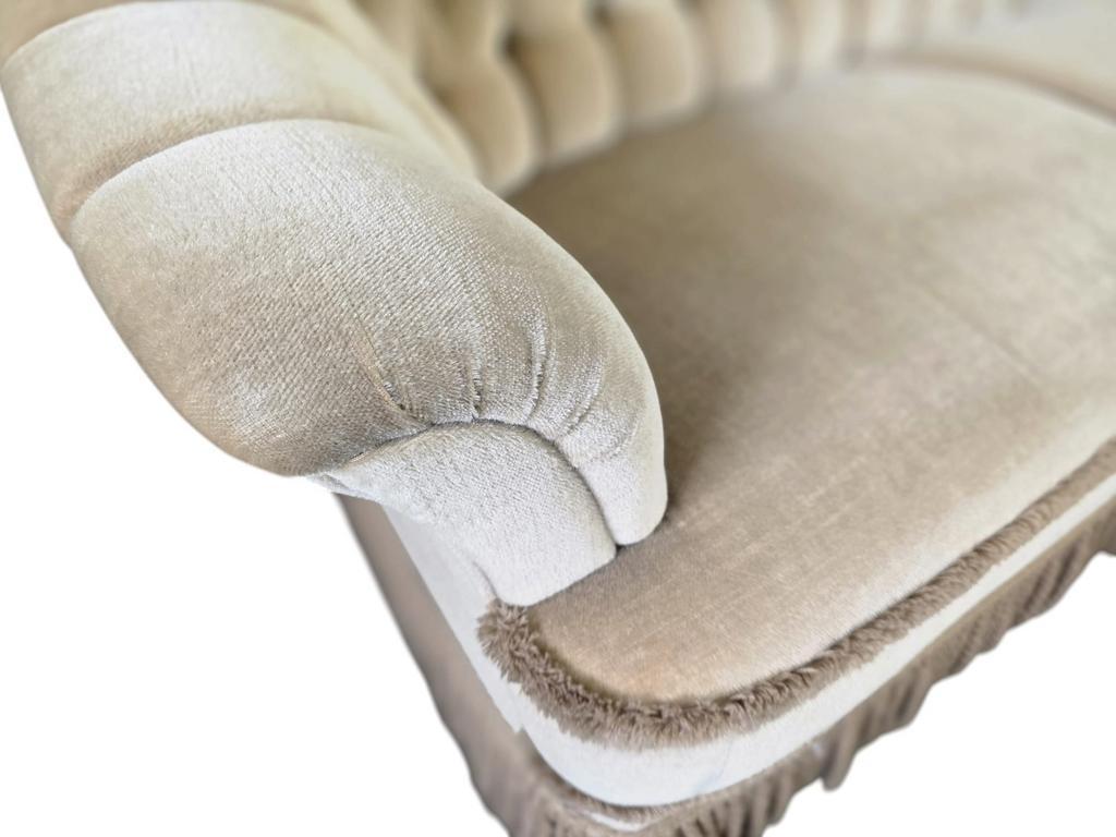 Canapé vintage beige avec franges