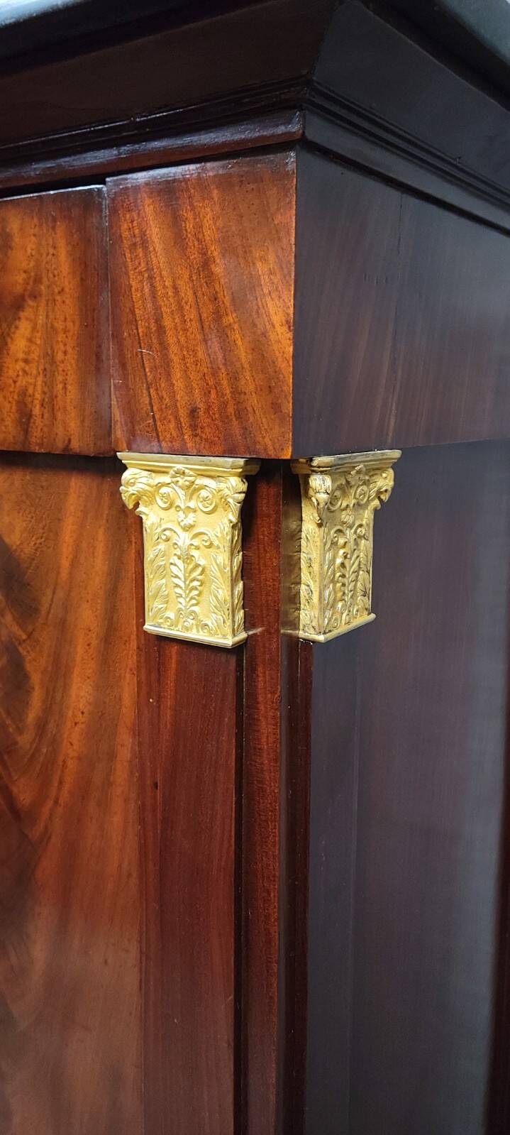 Rare four-column secretary from the Empire period in flame mahogany and bronze.