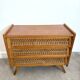 Vintage commode with tapered legs in rattan.