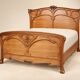 Double bed from the Art Nouveau period – Carved mahogany – Relief flowers