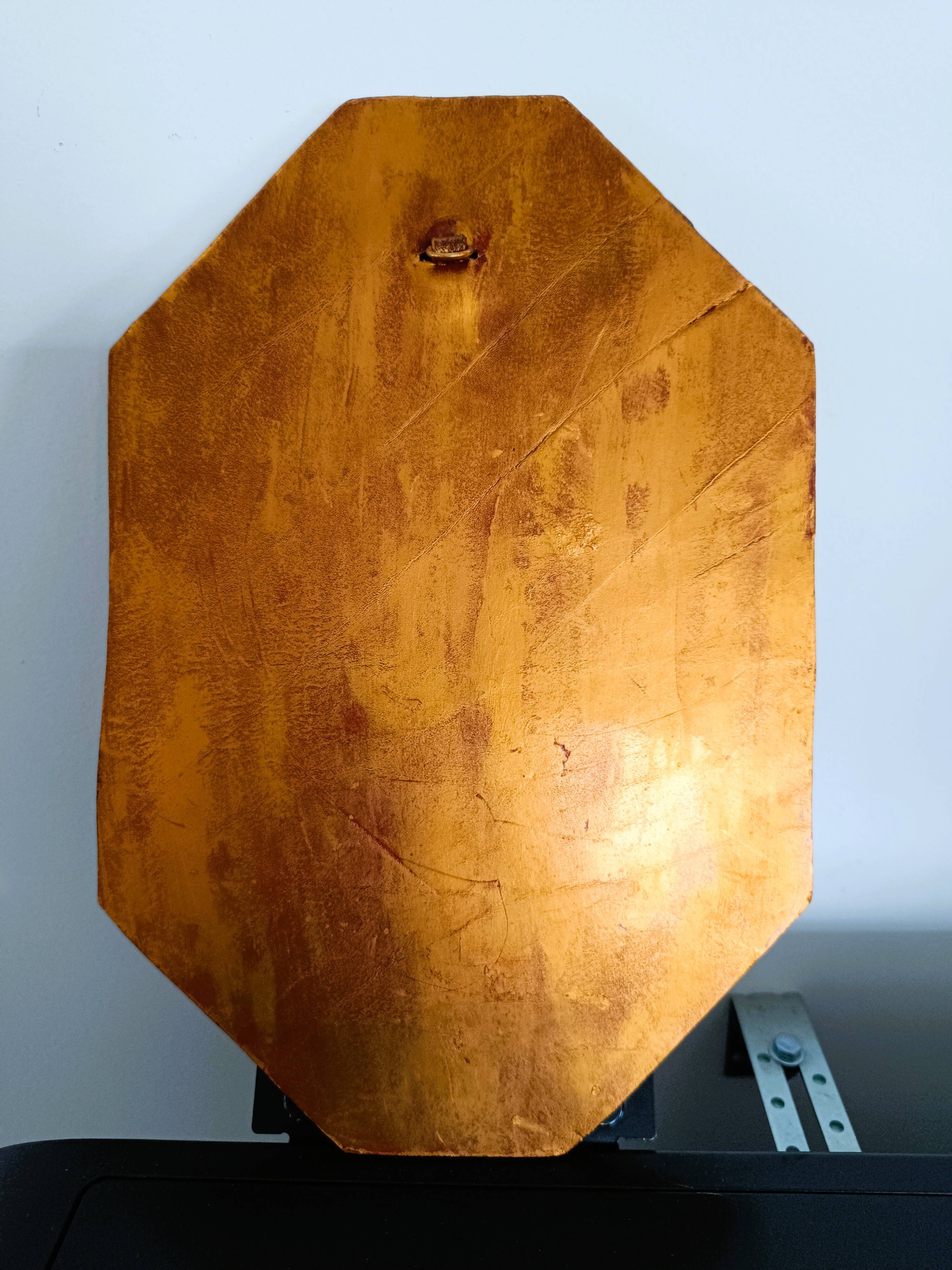 Small octagonal mirror in gold leather