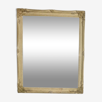 Beveled mirror in carved wood