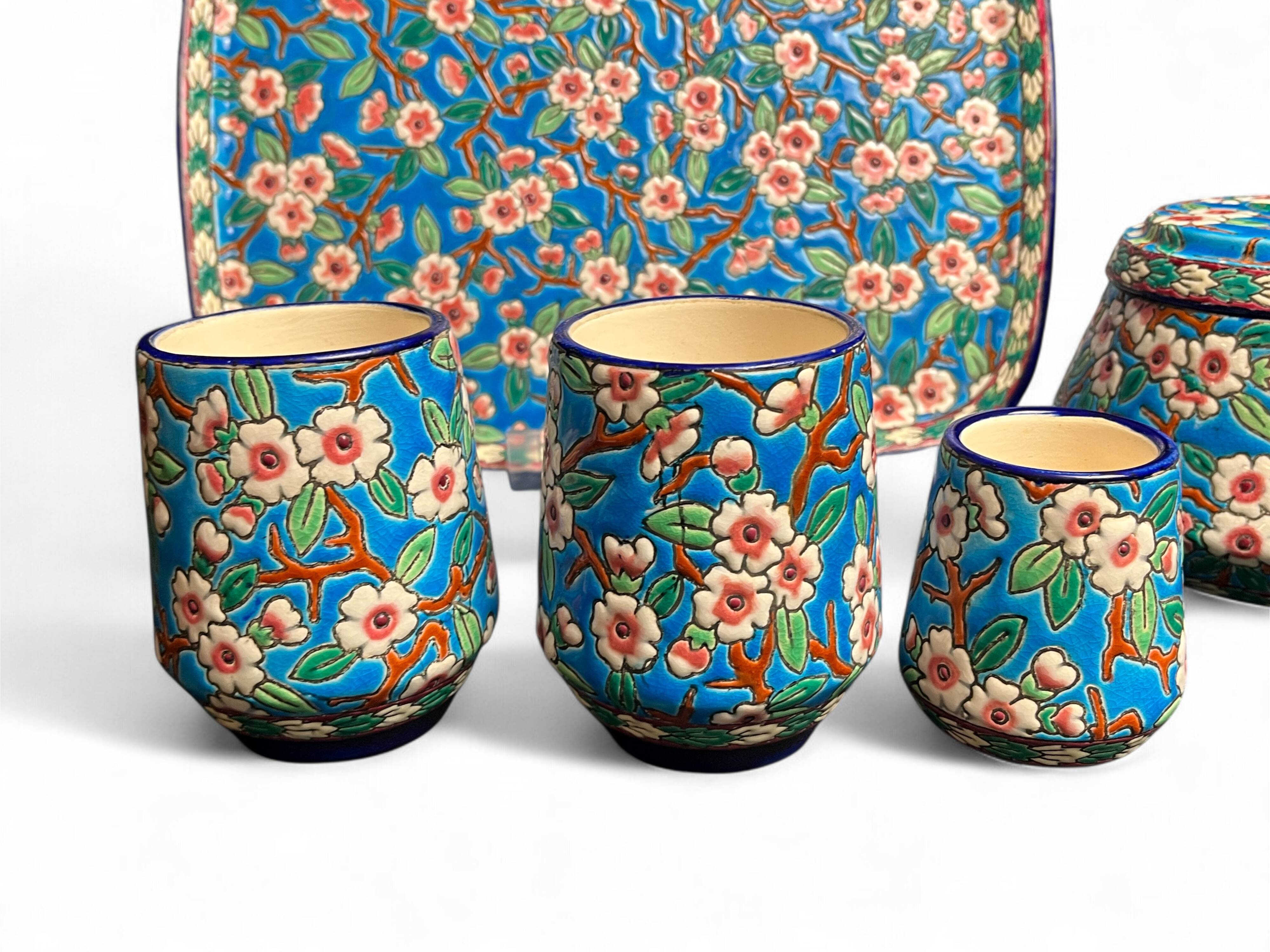 Longwy, cherry blossom glazed earthenware smoking set, early 20th century